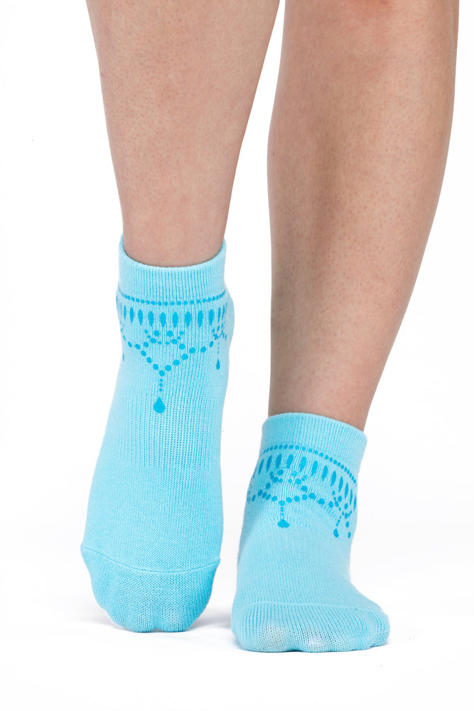 Front view of turquoise ankle sock with darker blue anklet silk screening.