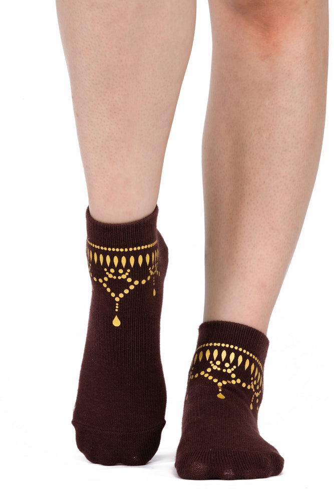 Front view of brown ankle sock with gold anklet silk screening.
