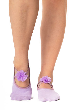 Lavender cotton sock with straps in the shape of an X, adorned with flower detail.