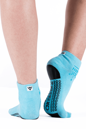 Back view of turquoise ankle sock with darker blue anklet silk screening.