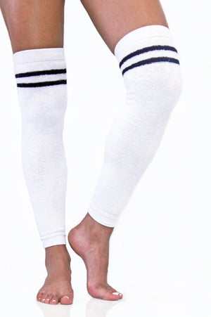 White terry legwarmers with black stripes accented with a gold Arebesk embroidered logo.
