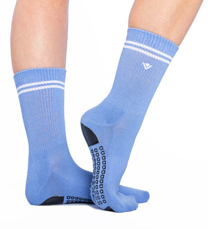 Product shot of periwinkle crew grip socks with white stripes on a white background.