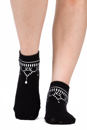Front view of black ankle sock with silver metallic anklet silk screening.