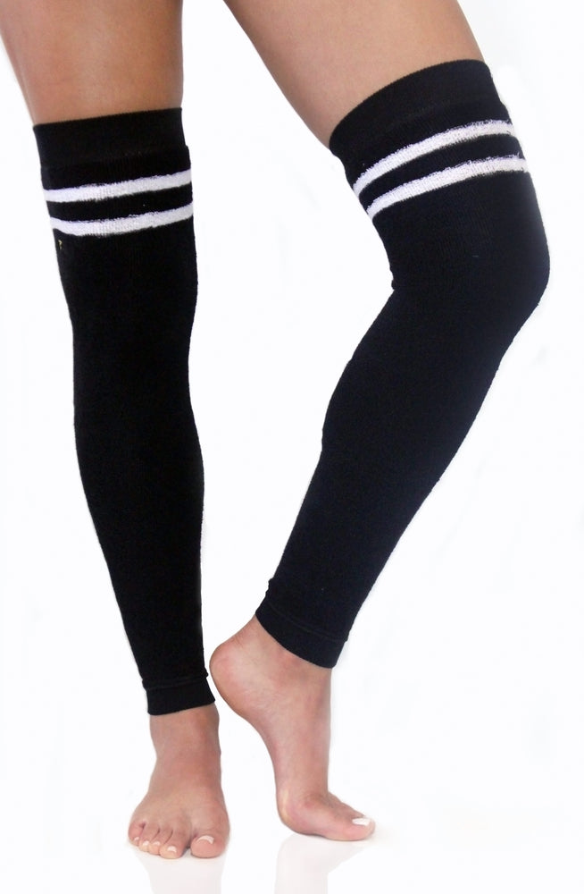 Black terry legwarmers with white stripes accented with a gold Arebesk embroidered logo.