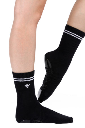 Black crew socks with white stripe detailing at the top of the sock and embroidered Arebesk logo.